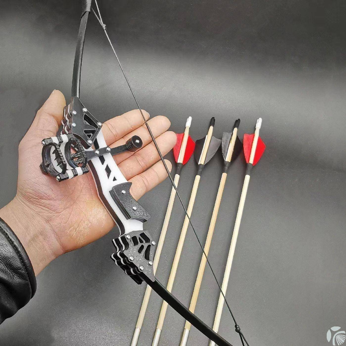 A generation of hard plastics with bows + 4 arrows + target paper + wrench